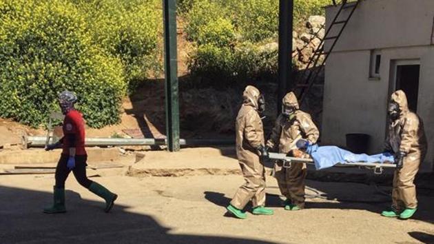 In this photo taken on Tuesday, April 4, 2017 and made available Wednesday, April 5, Turkish experts carry a victim of alleged chemical weapons attacks in Syrian city of Idlib, at a local hospital in Reyhanli, Hatay, Turkey.(AP)