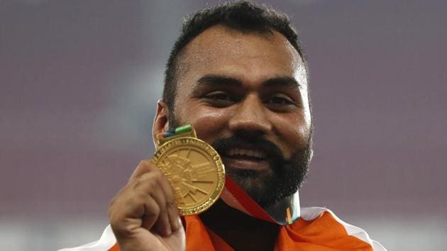 Gold medallist Tajinderpal Singh Toor of India on the podium.(REUTERS)