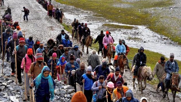 Pilgrims cross mountain trails during their religious journey to the Amarnath cave temple, at Pahalgam in Anantnag district of Jammu and Kashmir. (PTI) Pilgrims cross mountain trails during their religious journey to the Amarnath cave temple, at Pahalgam in Anantnag district of Jammu and Kashmir. (PTI)