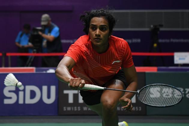 India's V. Sindhu Pusarla hits a return against Thailand's Nitchaon Jindabol during their women's singles quarter-final badminton match. (AFP) India's V. Sindhu Pusarla hits a return against Thailand's Nitchaon Jindabol during their women's singles quarter-final badminton match. (AFP)