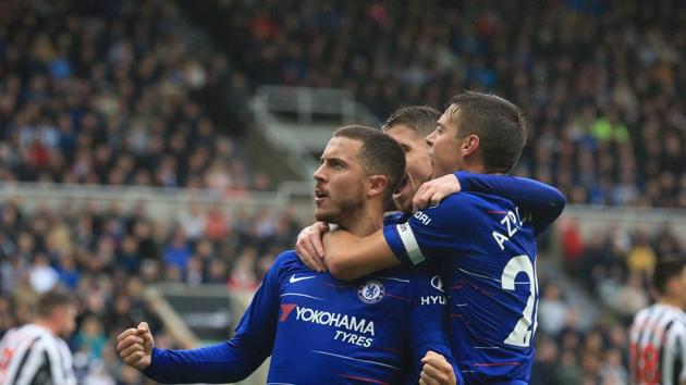 Chelsea's Belgian midfielder Eden Hazard (L) celebrates scoring the opening goal during the English Premier League football match between Newcastle United and Chelsea at St James' Park.(AFP)