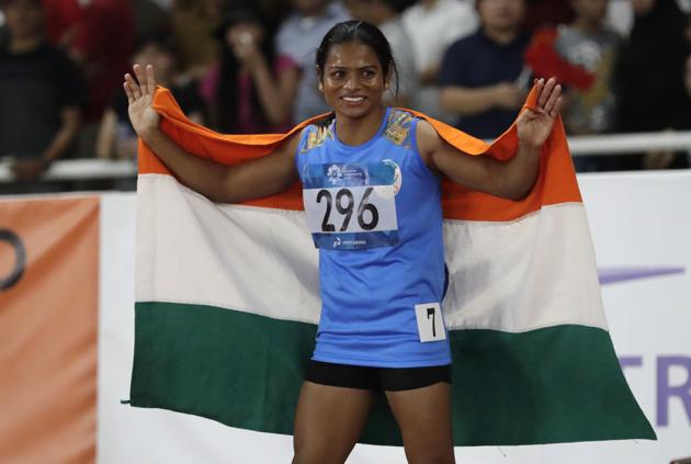 India's Dutee Chand celebrates after the women's 100m final at the 18th Asian Games in Jakarta, August 26 (AP) India's Dutee Chand celebrates after the women's 100m final at the 18th Asian Games in Jakarta, August 26 (AP)