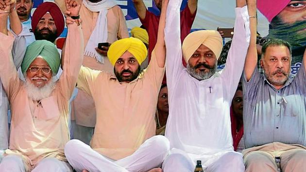 (From second left) Sangrur MP Bhagwant Mann, leader of opposition Harpal Singh Cheema and AAP state co-president Balbir Singh at Baba Bakala near Amritsar on Sunday. (HT Photo) (From second left) Sangrur MP Bhagwant Mann, leader of opposition Harpal Singh Cheema and AAP state co-president Balbir Singh at Baba Bakala near Amritsar on Sunday. (HT Photo)