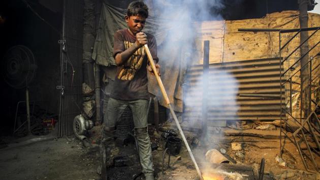 For the last five years, Arif has worked with his father and uncles in this factory that makes wheels for ships. Back in his village he went to school, played with friends and took care of his calf. Now, from morning to evening he works surrounded by loud sounds, fiery heat and clouds of toxic dust. This is his life after Cyclone Alia destroyed his home, salted the family lands and killed his calf. (GMB Akash)