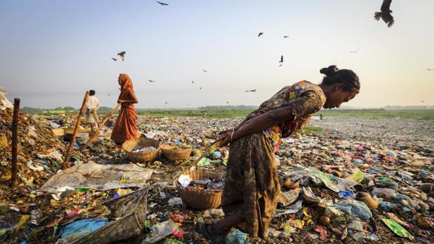 Nurjahan Begum was just picking up life after Cyclone Sidr when Aila hit, taking away her crops, home and dignity. Her father-in-law died in grief at their loss and her husband deserted the family, marrying for money. She now works in this Narayanganj dumpyard with her two daughters taking care of her mother and mother-in-law. Her daughters are uneducated and this work has brought social ostracism. (GMB Akash)