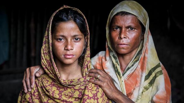 Parvin Akter moved to a rice field in Ashuganj two years ago with her two of her four daughters leaving behind life in Satkhira. Life that had become bruised with the salt Cyclone Aila left behind, taking with it her husband. Her years have been spent protecting them from danger and ensuring the luxury of fresh water. It’s back breaking work in the field, but water is guaranteed. So she toils. (GMB Akash)