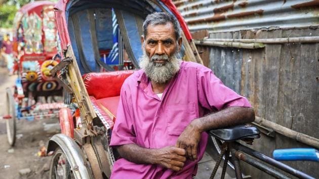 Rohomot Ali came to Dhaka two years ago, leaving behind his wife of 50 years. Suffering malnutrition, she lives in a drought affected area and battles deteriorating health. Ali is wracked by concern for his ailing wife and his inability to earn enough to send back home for her food or treatment or bring her to live with him in Dhaka. He wishes to be by her side when she dies. (GMB Akash)