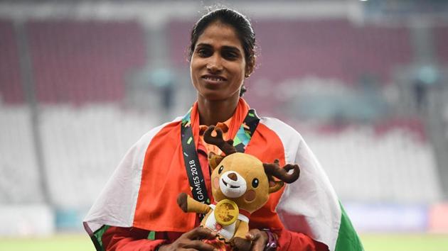 Silver medallist India's Sudha Singh celebrates during the victory ceremony for the women's 3000m steeplechase athletics event. (AFP) 