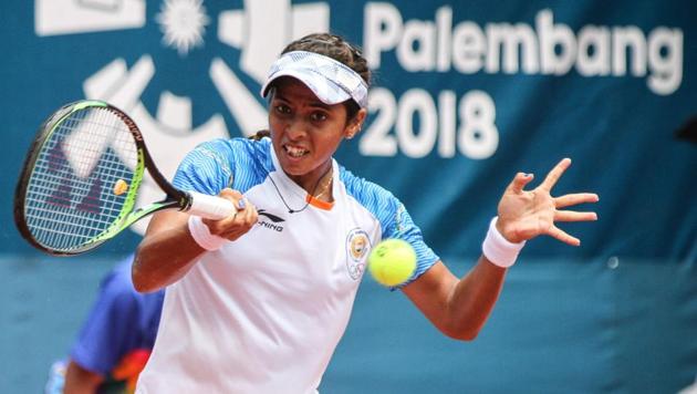 India's Ankita Ravinderkrishan Raina hits a return against China's Zhang Shuai in their women's singles tennis semi-final match at the 2018 Asian Games in Palembang on August 23, 2018.(AFP)