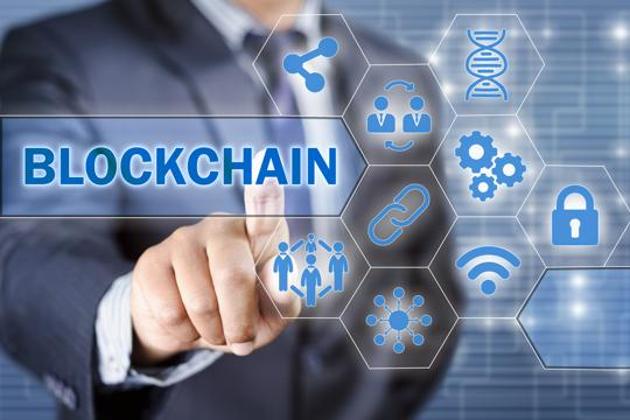 Businessman choosing blockchain technology illustrated with icons(Getty Images/iStockphoto)