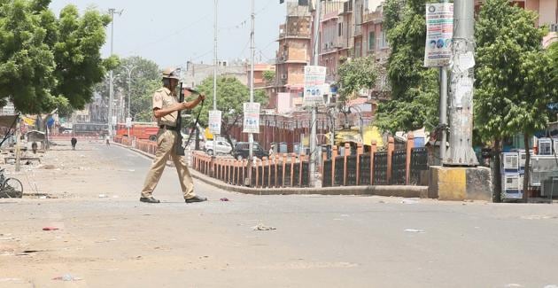 An armed policeman in Ramganj Bazar area of Jaipur after curfew was imposed following arson by mob and death of a civilian in clashes between police and the mob. (HT File Photo) An armed policeman in Ramganj Bazar area of Jaipur after curfew was imposed following arson by mob and death of a civilian in clashes between police and the mob. (HT File Photo)
