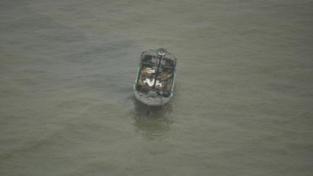 An Indian fishing boat in the Arabian Sea is seen after the fishermen were rescued in Thiruvananthapuram. Six fishermen swam to safety while one was missing after their boat capsized in the Arabian Sea off the Uttan coast Thane, police said on Monday.(Representative Image/AP Photo)