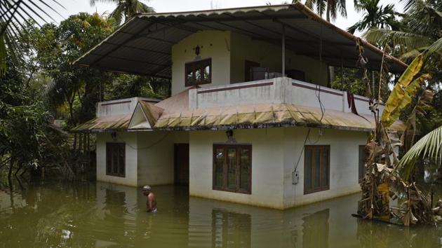 A man wades through water after arriving to inspect his flood affected house in Kuttanad, Alappuzha in Kerala on August 27. (AP Photo) A man wades through water after arriving to inspect his flood affected house in Kuttanad, Alappuzha in Kerala on August 27. (AP Photo)