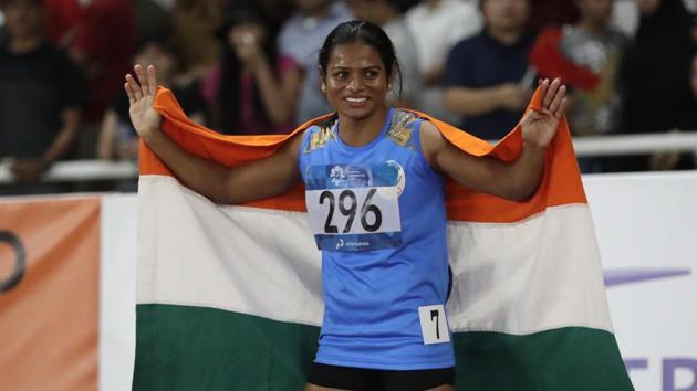Dutee Chand celebrates after her second place finish in the women's 100m final during the athletics competition at the 18th Asian Games in Jakarta.(AP)