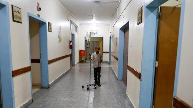 A boy who has cancer walks with an intravenous drip at The National Oncology Centre. The WHO said that prior to the conflict, the centre used to receive $15 million a year from the state and that the budget was used to purchase chemotherapy medications and anti-cancer drugs for oncology centres across the country. (Khaled Abdullah / REUTERS)