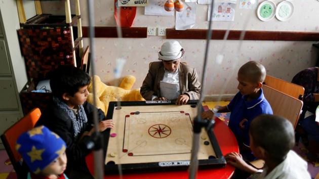 Children with cancer play as they receive chemotherapy at The National Oncology Centre. The centre in Sanaa admits around 600 new cancer patients each month. But it received only $1 million in funding last year from state entities and international aid groups, the head of the centre, Ahmed al-Ashwal, told Reuters. (Khaled Abdullah / REUTERS)