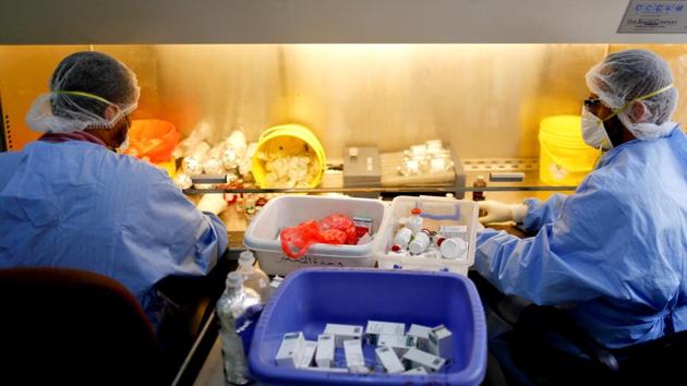 Chemists prepare medication dosages at The National Oncology Centre in Sanaa. “It is very difficult to find medicines, and if you find them in the market, they’re too expensive and citizens cannot afford them,” said Mohammed Al-Emad, accompanying a relative going for treatment in the capital. (Khaled Abdullah / REUTERS)
