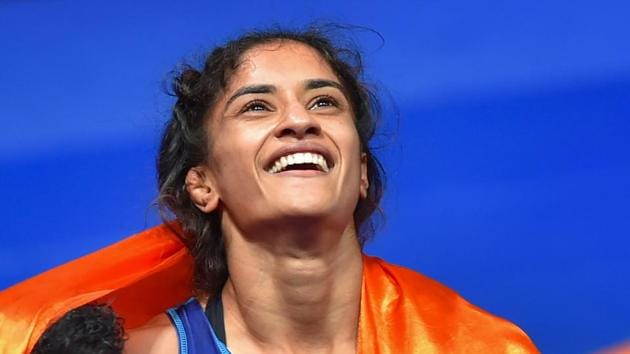 Jakarta: India's Vinesh Phogat celebrates after winning the Gold medal in women's freestyle 50 kg wrestling at the Asian Games 2018, in Jakarta on Monday, August 20, 2018. Phogat made history after she became the first Indian woman to win a gold at Asian Games. She beat Japan’s Irie Yukie 6-2 in the finals.(PTI)