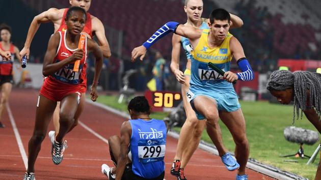 Athletes compete in the final of the mixed 4x400m relay athletics event during the 2018 Asian Games in Jakarta.(AFP)