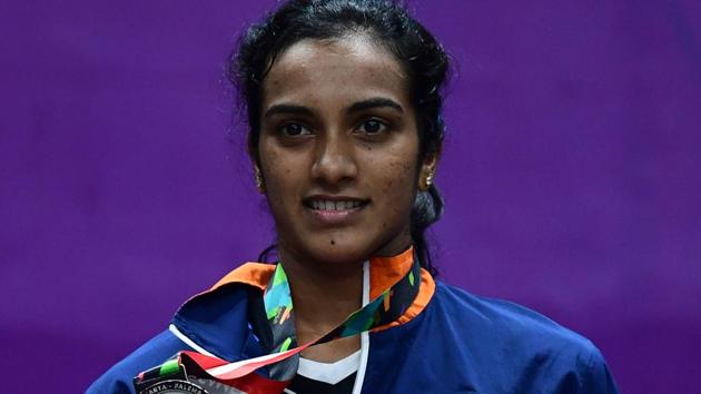 Silver medallist India's V. Sindhu Pusarla poses with her medal during the awards ceremony for the women's singles badminton. (AFP) Silver medallist India's V. Sindhu Pusarla poses with her medal during the awards ceremony for the women's singles badminton. (AFP)