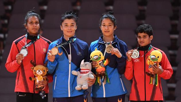 Silver medallist India's Pincky Balhara (L) and bronze medallists Uzbekistan's Oysuluv Abdumajidova (2R) and India's Malaprabha Yallapa Jadhav pose during the medal ceremony for the women's -52kg kurash.(AFP) Silver medallist India's Pincky Balhara (L) and bronze medallists Uzbekistan's Oysuluv Abdumajidova (2R) and India's Malaprabha Yallapa Jadhav pose during the medal ceremony for the women's -52kg kurash.(AFP)