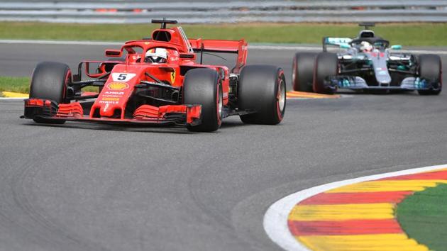 Ferrari's German driver Sebastian Vettel competes ahead of Mercedes' British driver Lewis Hamilton during the Belgian Formula One Grand Prix at the Spa-Francorchamps circuit in Spa on August 26, 2018.(AFP)