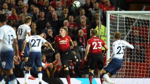 Tottenham Hotspur's English striker Harry Kane (2L) scores the opening goal during the English Premier League football match between Manchester United and Tottenham Hotspur at Old Trafford in Manchester, north west England, on August 27, 2018. (AFP) Tottenham Hotspur's English striker Harry Kane (2L) scores the opening goal during the English Premier League football match between Manchester United and Tottenham Hotspur at Old Trafford in Manchester, north west England, on August 27, 2018. (AFP)