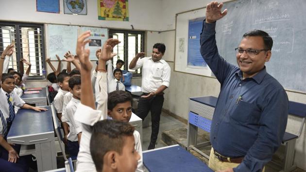 Principal CS Verma (R) and teacher Suresh Kumar take the happiness class. These classes were introduced by the Delhi government in its schools for children up to Class 8 for enhancing their mental and emotional well-being. The curriculum was rolled out on July 2 in the presence of the Dalai Lama at an event attended by chief minister Arvind Kejriwal and deputy chief minister Manish Sisodia. (Sanchit Khanna / HT Photo) Principal CS Verma (R) and teacher Suresh Kumar take the happiness class. These classes were introduced by the Delhi government in its schools for children up to Class 8 for enhancing their mental and emotional well-being. The curriculum was rolled out on July 2 in the presence of the Dalai Lama at an event attended by chief minister Arvind Kejriwal and deputy chief minister Manish Sisodia. (Sanchit Khanna / HT Photo)