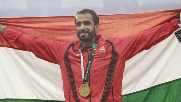 Men's 800m gold medalist India's Manjit Singh stands on the podium during the athletics competition at the 18th Asian Games. (AP)