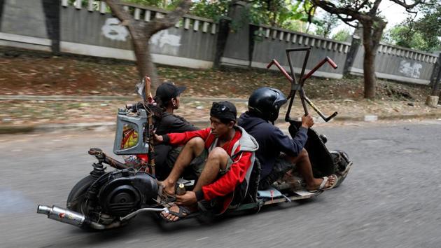 As the vehicles are often unlicensed, many travel at night to avoid traffic police. Mechanical problems arise, with some of the more ramshackle machines often breaking down. (Darren Whiteside / REUTERS)