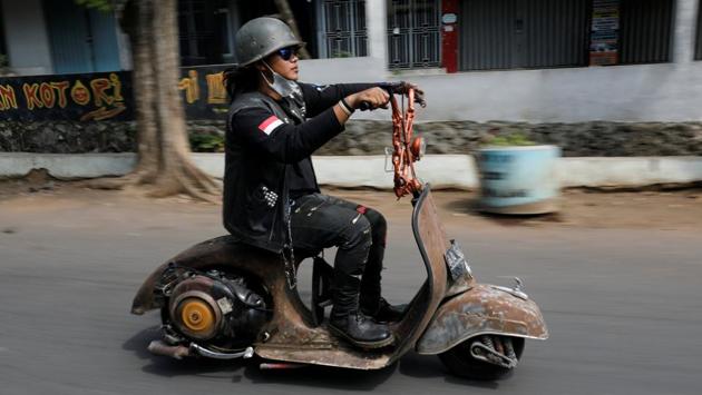 To enter into competitions at the festival, every customised vehicle must have a Vespa engine and most contestants try to retain the brand’s iconic fairing - the curved front of the scooter. (Darren Whiteside / REUTERS)