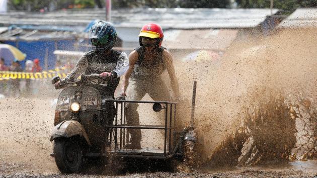 The three-day festival, now in its third year, is one of several held across the country. Highlights include a contest to pick the best-looking entry and dirt-track races for the speedier bikes. (Darren Whiteside / REUTERS)