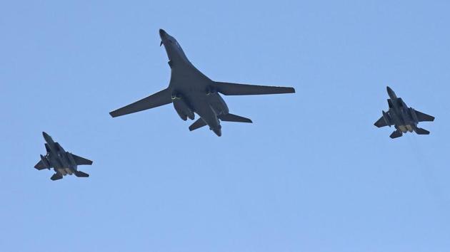 U.S. Air Force B-1B bomber, center, and two South Korean fighter jets F-15K fly over the Seoul Airport where a site for the 2017 Seoul International Aerospace and Defense Exhibition is taking place in Seongnam, South Korea.(AP File Photo)