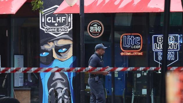 A Jacksonville Sheriff officer walks past the GLHF Game Bar where 3 people including the gunman were killed on August 27, 2018. (AFP Photo) A Jacksonville Sheriff officer walks past the GLHF Game Bar where 3 people including the gunman were killed on August 27, 2018. (AFP Photo)
