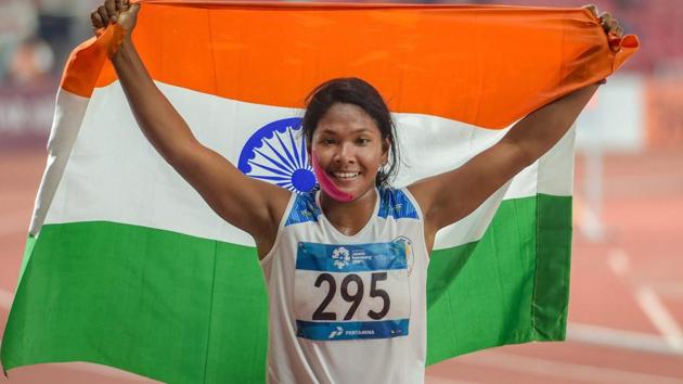 Jakarta: Indian athlete Swapna Barman celebrates after winning the gold medal in the women's Heptathlon event at the 18th Asian Games. (PTI)