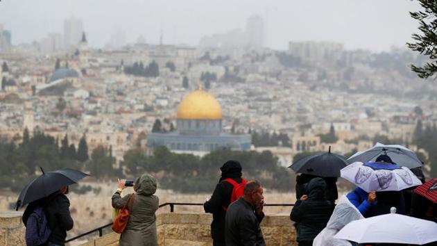 People stand at an observation point overlooking the Dome of the Rock and Jerusalem’s Old City.(Reuters File Photo)