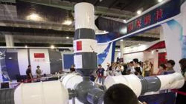 Visitors look at a model of China's Tiangong-1 space station at the China Beijing International High-Tech Expo in Beijing, Saturday, June 10, 2017. (AP File Photo) Visitors look at a model of China's Tiangong-1 space station at the China Beijing International High-Tech Expo in Beijing, Saturday, June 10, 2017. (AP File Photo)