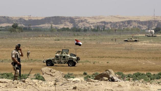 File photo of Iraqi soldiers patrolling along the border between Syria and Iraq in Anbar province, Iraq. (AP Photo) File photo of Iraqi soldiers patrolling along the border between Syria and Iraq in Anbar province, Iraq. (AP Photo)