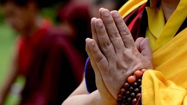 A Buddhist monk offers prayers at Raj Ghat.(AFP File Photo/Representative image)