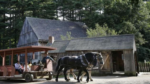A horse-drawn wagon makes its way past a building at Old Sturbridge Village. “What this grant will allow us to do is look at the entire picture and really dive deep into making sure that it’s a cohesive, purposeful experience for the visitor as they progress through the museum,” said Rhys Simmons, Old Sturbridge Village’s director of interpretation. (Steven Senne / AP) A horse-drawn wagon makes its way past a building at Old Sturbridge Village. “What this grant will allow us to do is look at the entire picture and really dive deep into making sure that it’s a cohesive, purposeful experience for the visitor as they progress through the museum,” said Rhys Simmons, Old Sturbridge Village’s director of interpretation. (Steven Senne / AP)