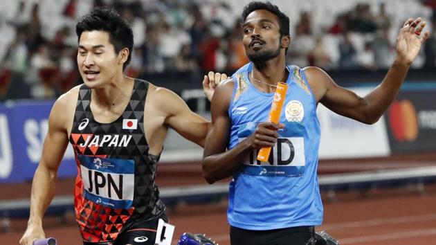 Shota Iizuka of Japan in action with Arokiarajiv of India during the men’s 4x400 relay. (REUTERS) Shota Iizuka of Japan in action with Arokiarajiv of India during the men’s 4x400 relay. (REUTERS)