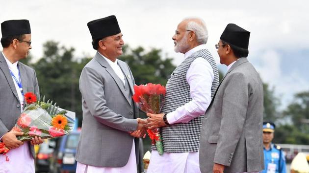 Nepal Deputy Prime Minister and Defence Minister Ishwor Pokhrel received PM Narendra Modi at the Tribhuvan International Airport in Kathmandu.(MEA/Twitter)