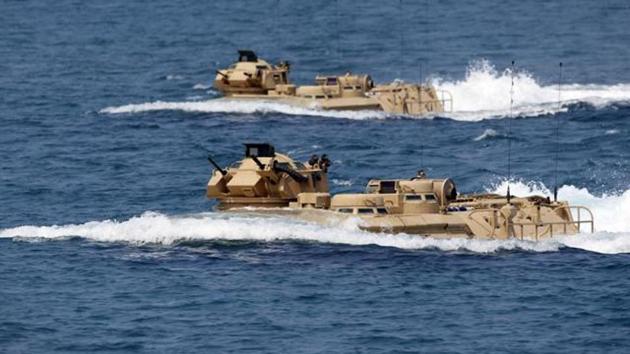 US military forces aboard Amphibious Assault Vehicles (AAV) manuevre on South China Sea near the shore of San Antonio, Zambales during the annual "Balikatan" (shoulder-to-shoulder) war games with Filipino soldiers in northern Philippines(REUTERS File Photo)