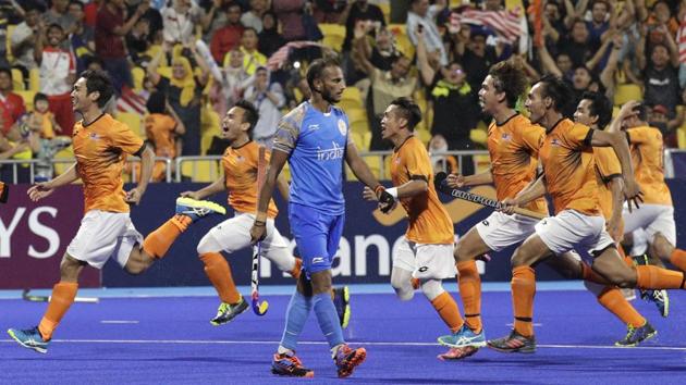 Malaysia's team jubilate after winning against India during their men's hockey semi-final match. (AP) Malaysia's team jubilate after winning against India during their men's hockey semi-final match. (AP)