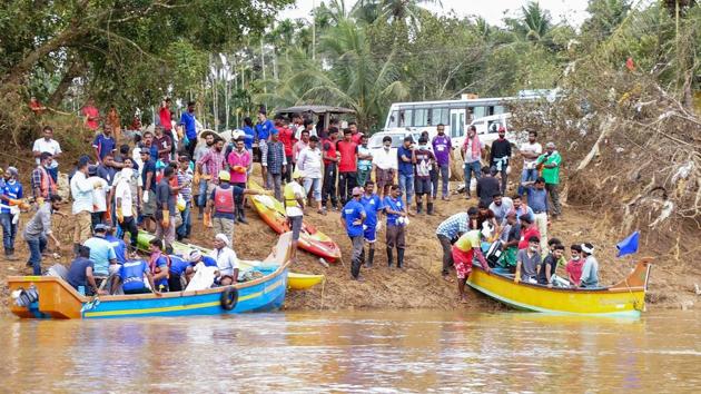 Volunteers and locals ride a boat to as they head out to clean Panamaram River, in Wayanad on Thursday, Aug 30, 2018. (PTI) Volunteers and locals ride a boat to as they head out to clean Panamaram River, in Wayanad on Thursday, Aug 30, 2018. (PTI)