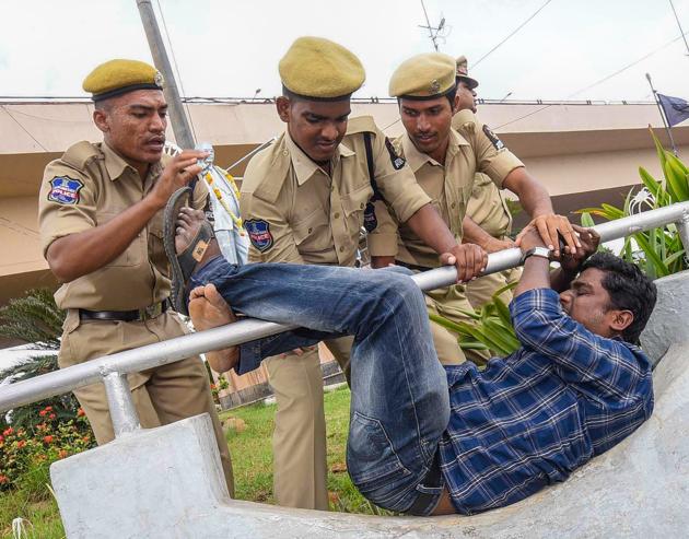 Police detain an activist during a protest against the arrest of revolutionary writer Varavara Rao in Hyderabad on Wednesday.(PTI Photo)