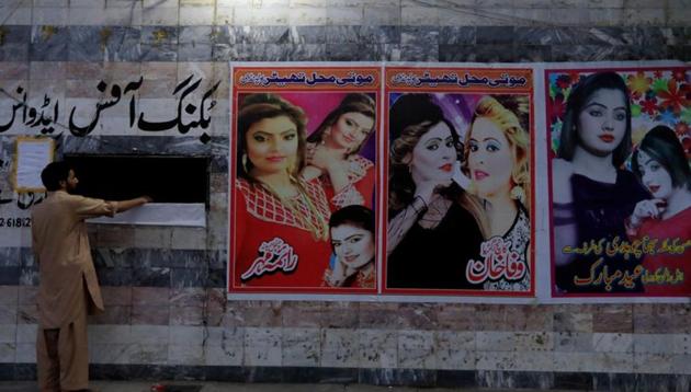 A man stands at the ticket counter with film posters at a cinema in Rawalpindi, Pakistan August 30, 2018. (REUTERS) A man stands at the ticket counter with film posters at a cinema in Rawalpindi, Pakistan August 30, 2018. (REUTERS)