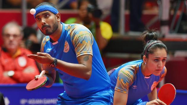 India’s Achantab Sharath and Manika Batra during the mixed-double table tennis match against Korea in the 18th Asian Games 2018 in Jakarta. (Shahbaz Khan / PTI) India’s Achantab Sharath and Manika Batra during the mixed-double table tennis match against Korea in the 18th Asian Games 2018 in Jakarta. (Shahbaz Khan / PTI)