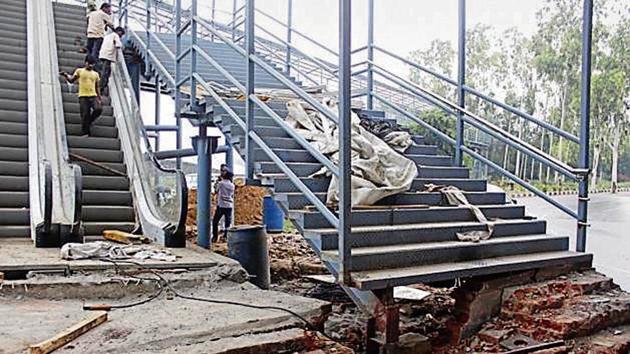 The foot overbridge at Signature Towers was damaged after heavy rain on Tuesday morning(HT File Photo)