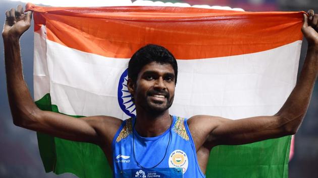 India's Jinson Johnson celebrates winning the final of the men's 1500m athletics event during the 2018 Asian Games in Jakarta on August 30, 2018.(AFP)